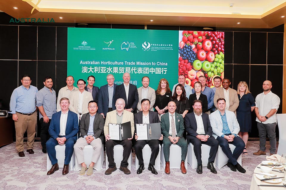 Group of delegates in front of a sign reading Australian Horticulture Trade Mission to China
