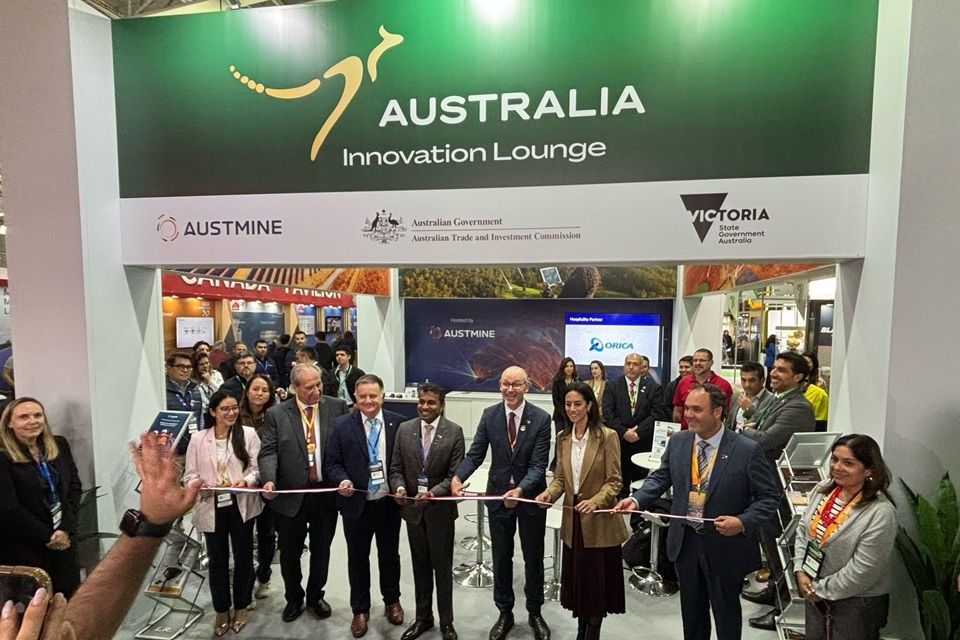 Group of delegates as Australian Innovation Lounge conference stand