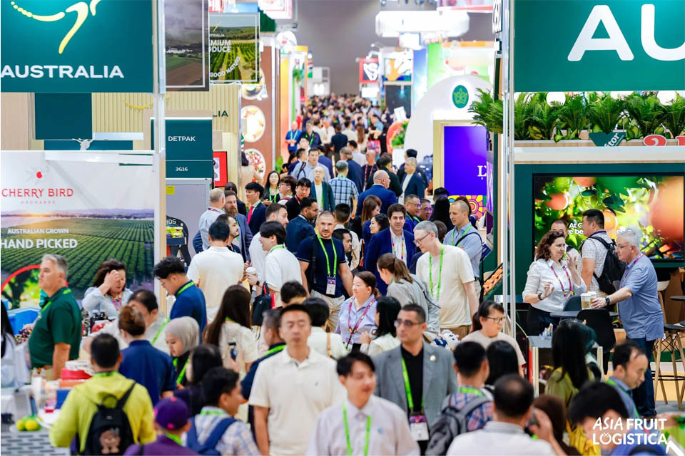 Crowds of attendees at an exhibition with the Australia Nation branded stand in the foreground