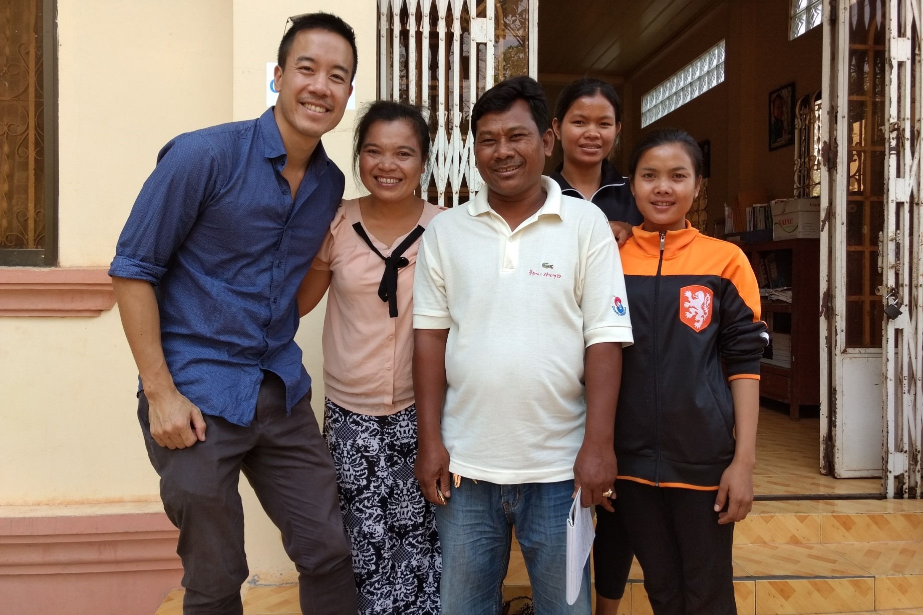 Five Cambodian people smiling for the camera
