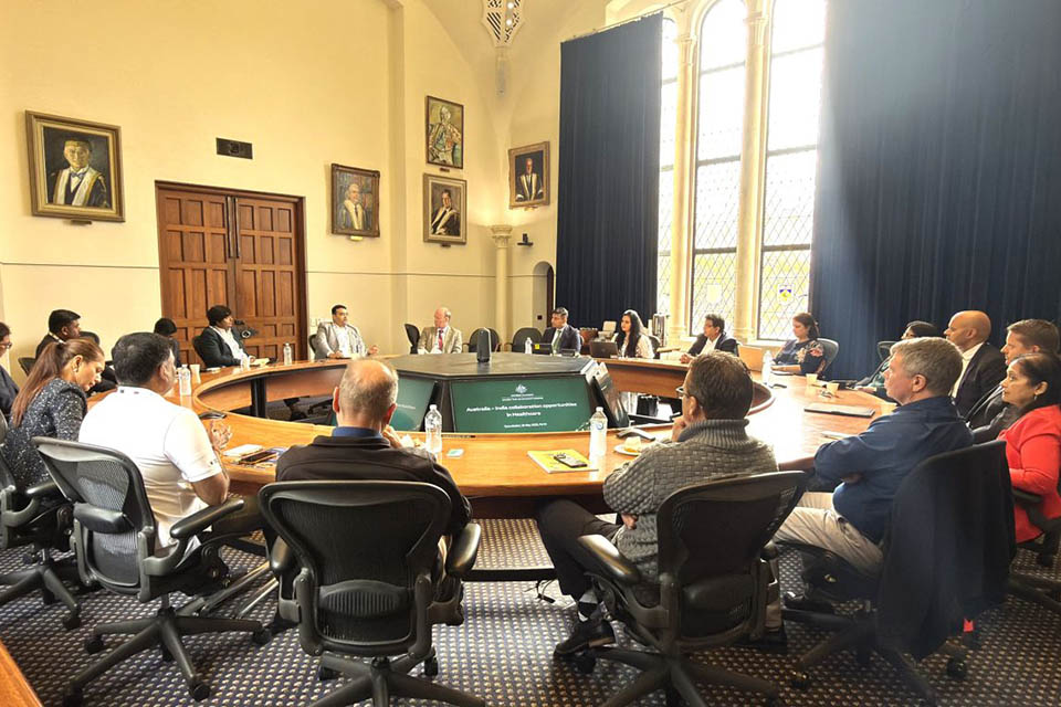 Group of people sitting around a circular table