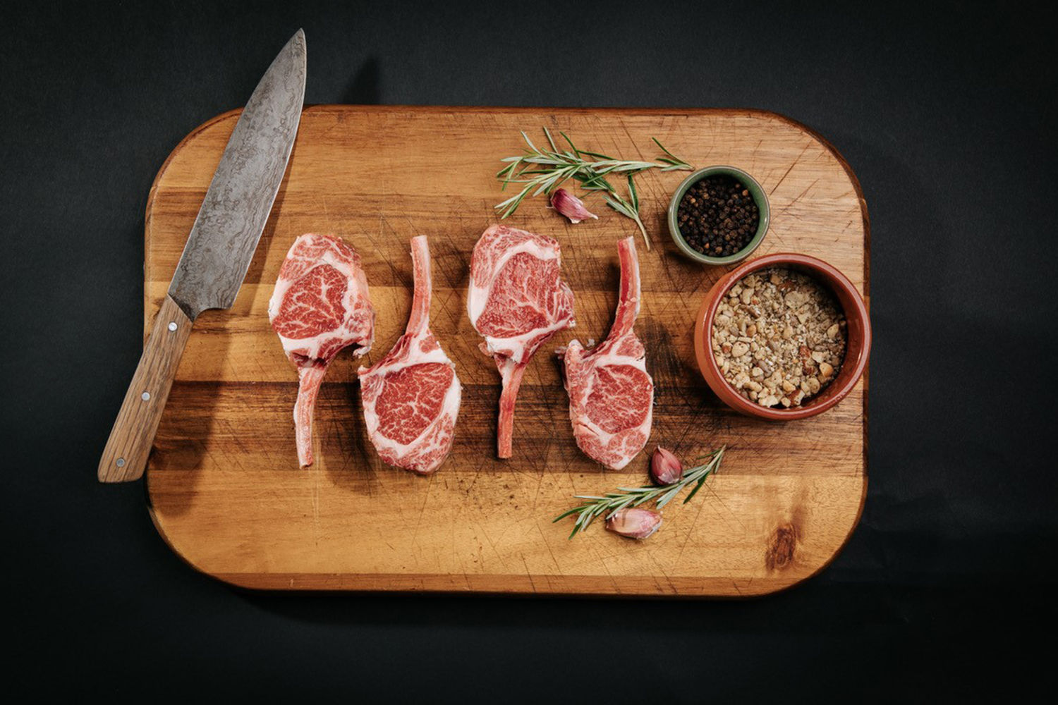 Lamb cutlets on a board