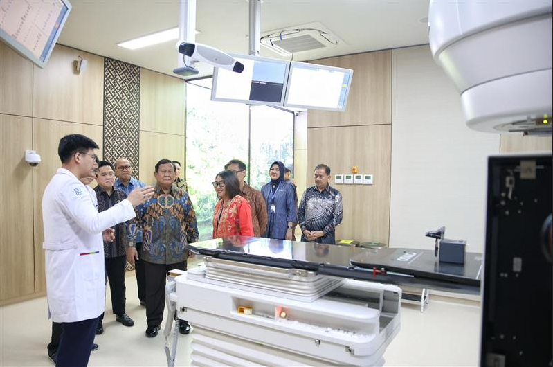 Officials touring a cancer care clinic